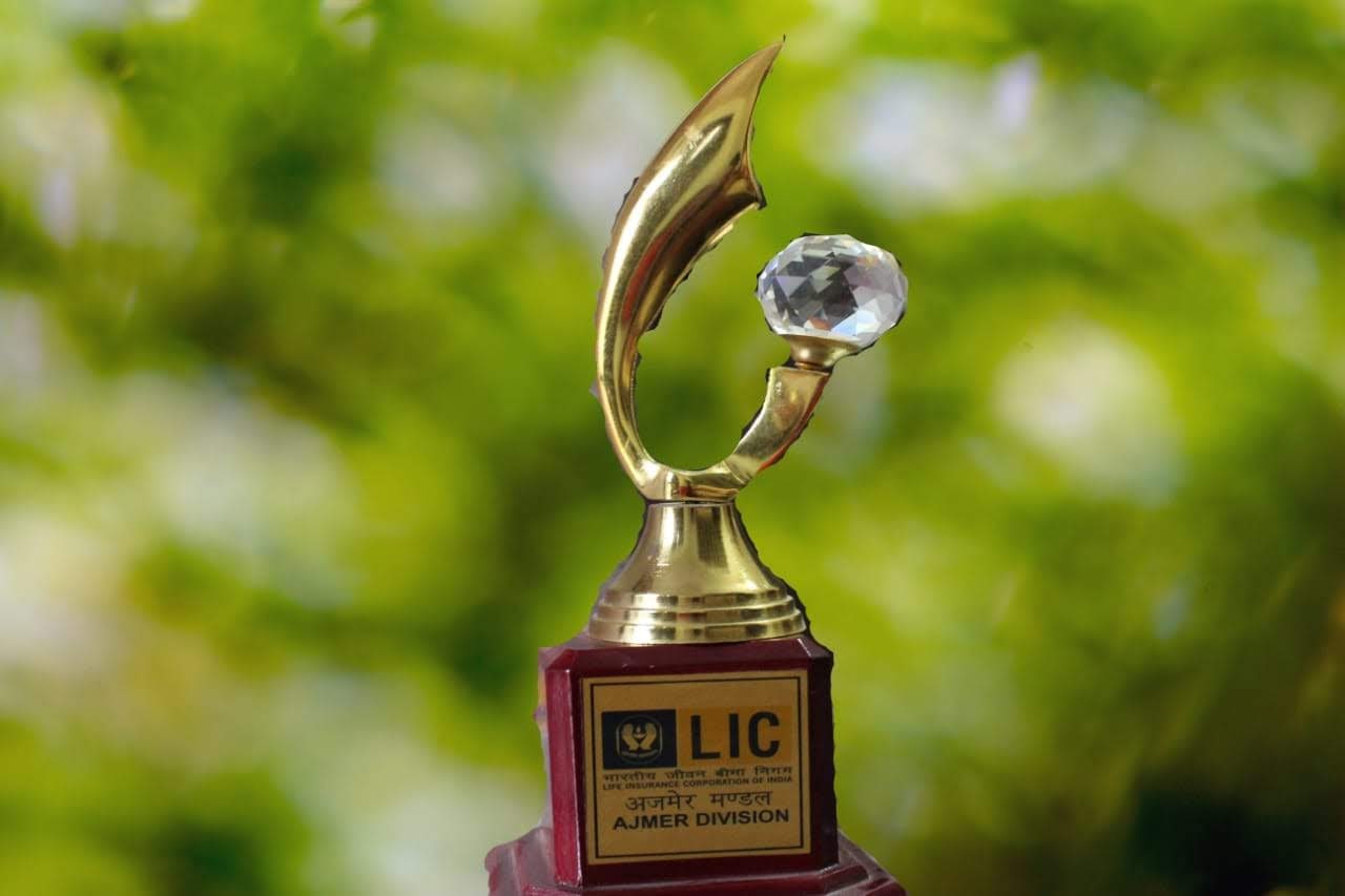 car interior from central back seat position showing driver and blurred view through windscreen of a busy road at night