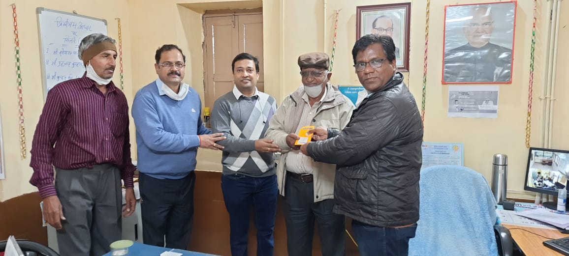 car interior from central back seat position showing driver and blurred view through windscreen of a busy road at night