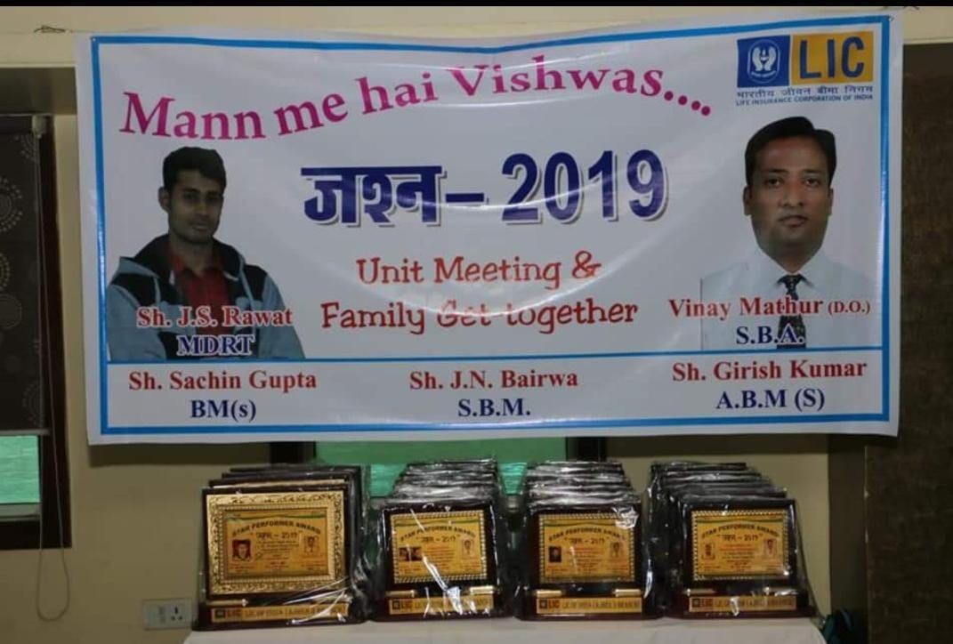 car interior from central back seat position showing driver and blurred view through windscreen of a busy road at night